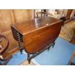 A mid Oak drop leaf gateleg Dining Table having twist legs,