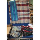 A box of mixed blanket, scarves, ties etc.