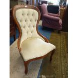 A darkwood show framed pale beige Draylon upholstered button back Chair on cabriole front legs.