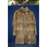 A honey coloured full length fur coat, a/f with distressed lining.