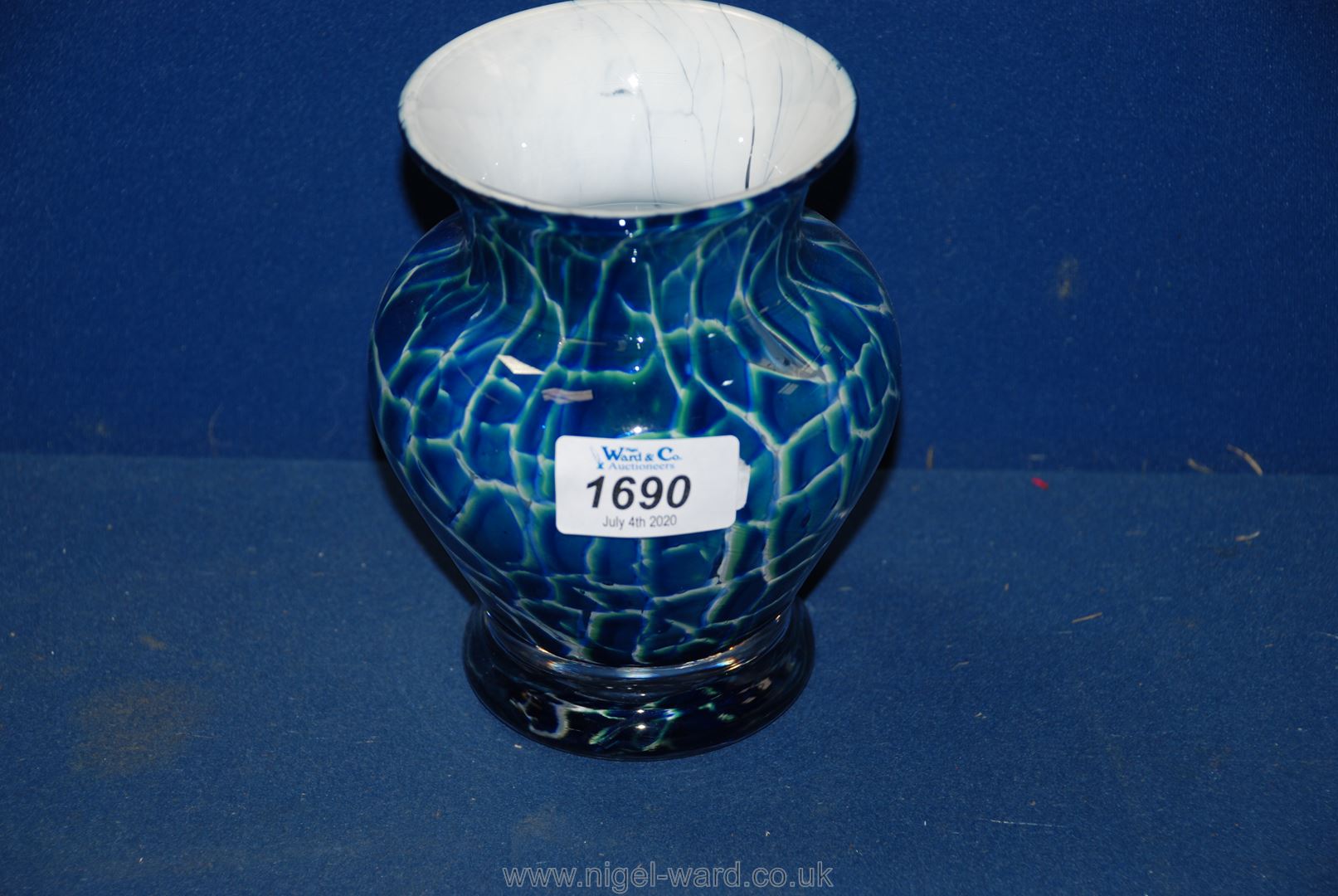 A Dartington Studio heavy glass vase in blue crazed effect with lime and white infill's,