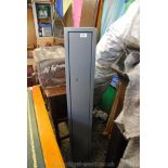 A steel wall attaching security Gun Cabinet, 52 3/8" high x 8" wide x 8 3/4" deep.