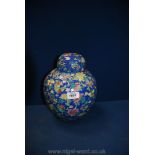 A large ginger jar in pretty floral design of various blooms in pink,