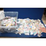 A plastic box of world Stamps.