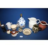 A blue tray of mixed pottery to include a blue and white table lamp, white jugs,