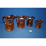 A set of four graduated lustre Jugs with blue highlights, chip to rim of one jug.