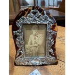 A pretty tortoiseshell and silver free-standing photograph frame suitable for a photograph 95 mm x