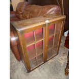 A 1950's Oak finished Bookcase, 30 1/2" high x 27" wide.