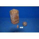 A wooden carved wall pot (wood cracked in some places) with oriental figures carved inside;