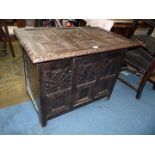 An unusual and appealing eastern design darkwood Blanket Chest decorated in relief with stylised