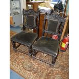 A pair of dark Oak hall Chairs having dark green velvet upholstered seats and backs,