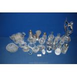 A quantity of glass items including bud vases, cruets, perfume bottles, paperweights,