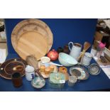 A box of mixed wooden and enamel items, jugs, jelly moulds, wooden tray, green sieve.