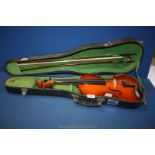 A cased 4/4 full size Violin with bow.