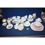 A quantity of part teasets and miscellaneous cups and saucers including Paragon, Woodlands, Coronet,