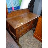 A 1930's Oak Washstand with two drawers and cupboard standing on twist legs,