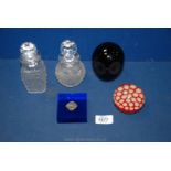 A small quantity of glass including cut and stoppered bottles and paperweights.