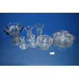 A quantity of glass including candlesticks, vases and bowls.