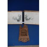 An oriental photograph album with paintings on silk, a/f and a carved wood Victorian picture frame,