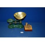 A pair of Victor weighing scales and box set of weights.