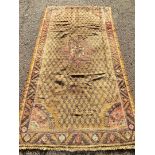 An antique hand-made Rug, circa 1900. 265cm x 145cm.