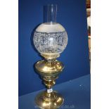 A brass Oil Lamp with etched glass dome shade. 22" tall.