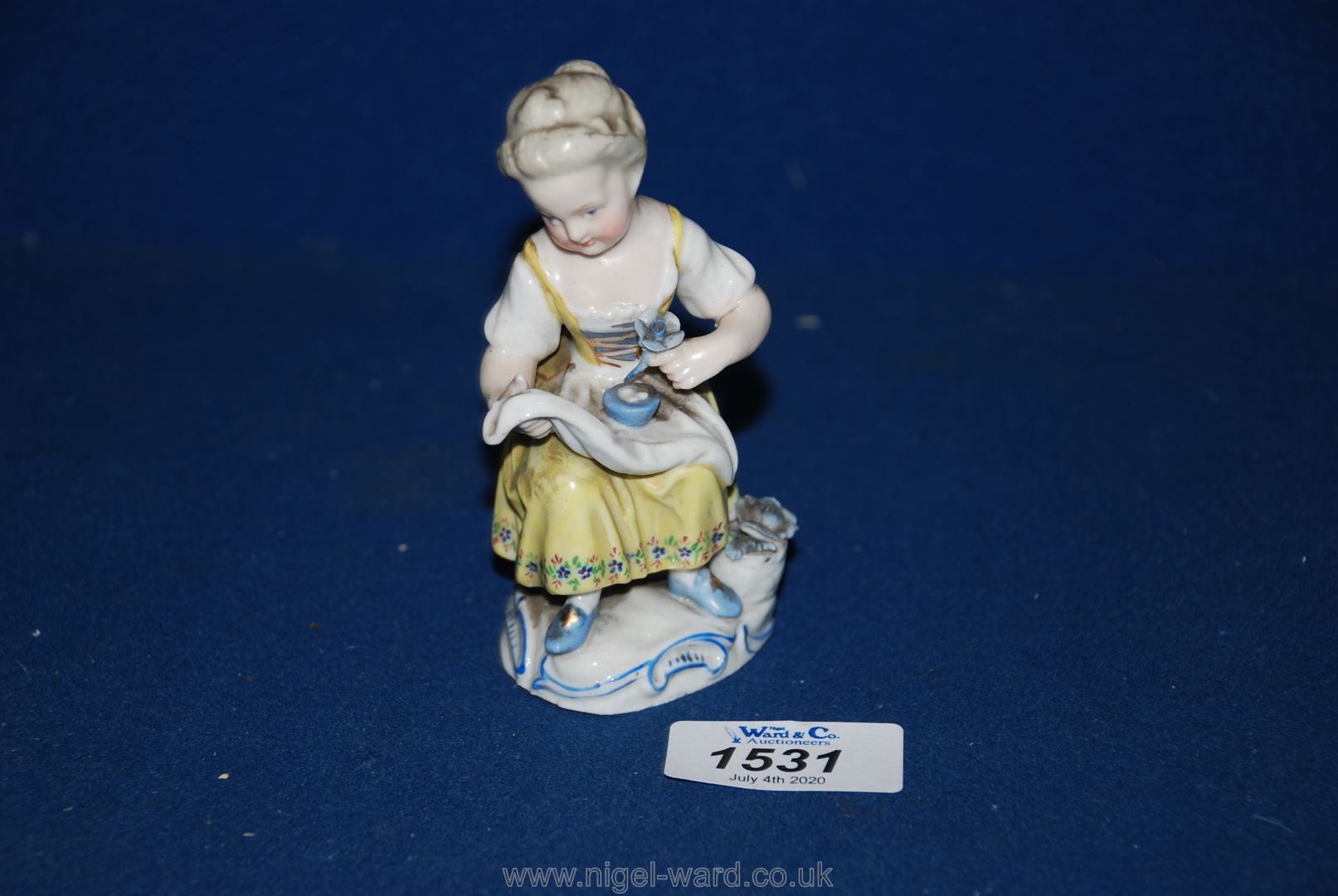 A small Sitzendorf porcelain figure of a young girl 4 1/4" tall.