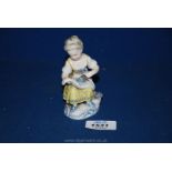 A small Sitzendorf porcelain figure of a young girl 4 1/4" tall.