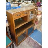 A 1940/50's Oak Display Cabinet/Bookcase, having double and single glazed doors,