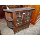 An Arts and Crafts wall hanging display Cabinet having corner shelves, 30" wide x 24 1/2 "high.