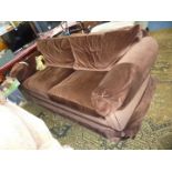 A brown dralon upholstered 3-4 seater settee.