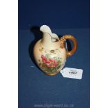 A Royal Worcester blush ground, hand painted Jug with gilt reeded handle,
