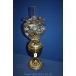 An engraved brass Oil Lamp. 24" tall.