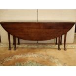 An Oak cabriole legged Wake Table, the top 77" x 20" extending to 75 1/2" x 29 1/2" high.
