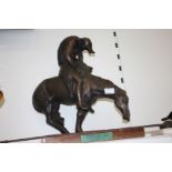 A reproduction figure on plinth 'End of the Trail' by James Earle Fraser, with spear a/f.
