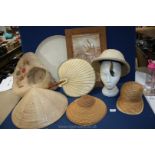 A box of straw hats, white desert hat, fan and large wooden tray etc.
