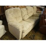 A pale beige upholstered shadow fabric pattern upholstered three seater Settee and matching Chair,
