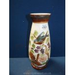 A Victorian glass vase painted with birds and flowers.