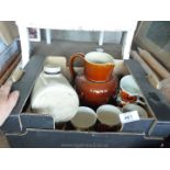 Box of salt glazed jug, hot water bottle, cups and saucers.