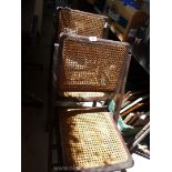 Two wicker folding chairs.