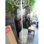 A white painted metal coat stand and stick.