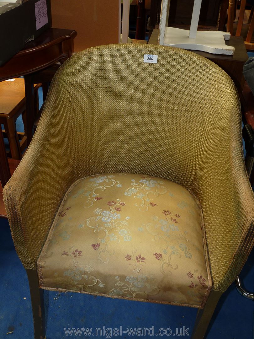 A Lloyd Loom style chair.