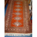 A bordered, patterned and fringed Persian runner, (some wear).