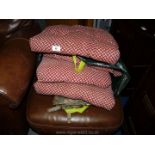 A quantity of chair cushions.