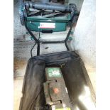 A rechargeable lawn mower with roller, two batteries, no charging unit.