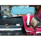 A black suitcase of fabric and wicker basket with table mats,