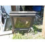 A solid fuel glass door enclosed stove type fire.