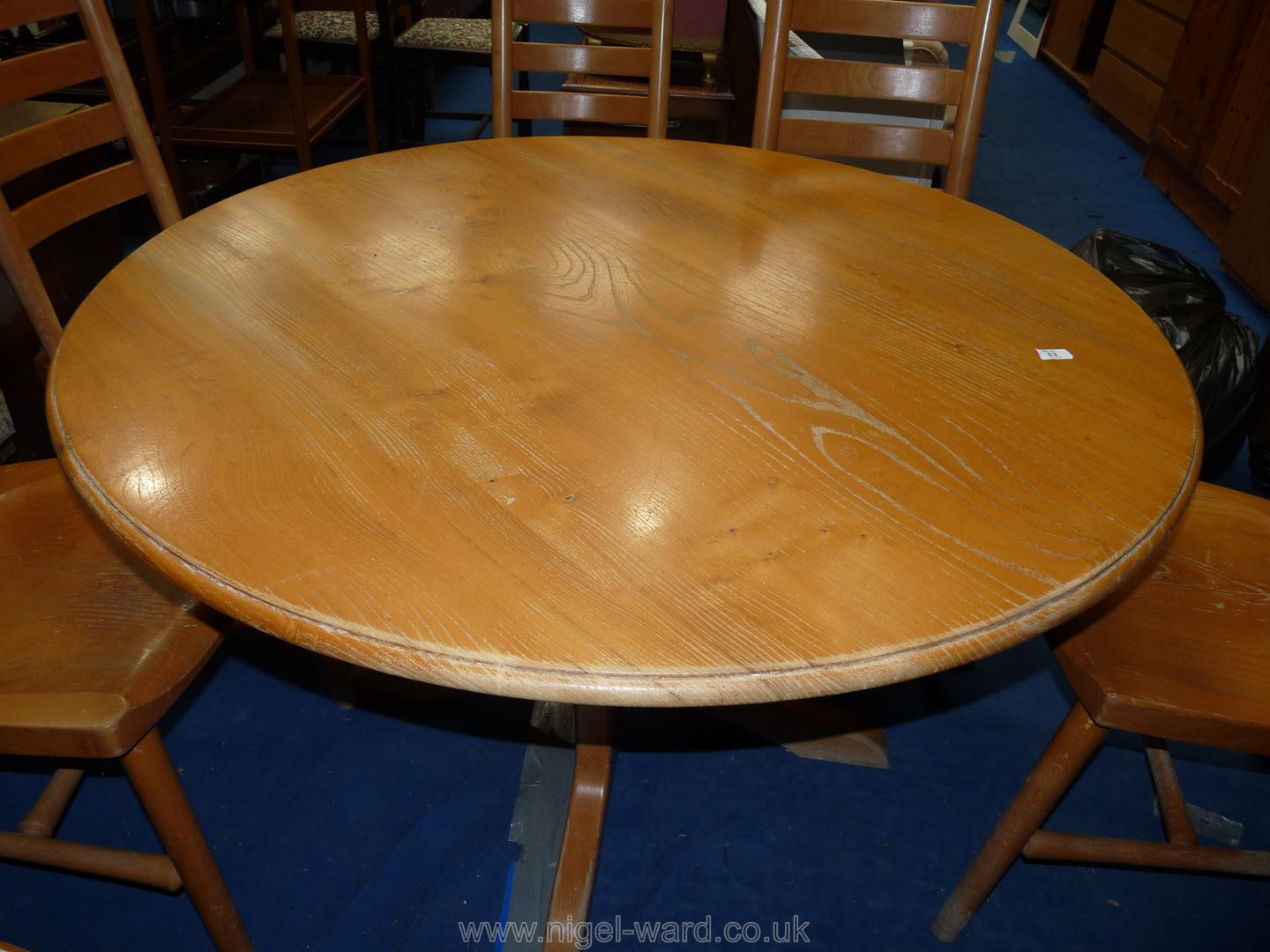 A circular Elm topped kitchen table.