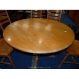 A circular Elm topped kitchen table.
