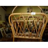 A rattan magazine rack.